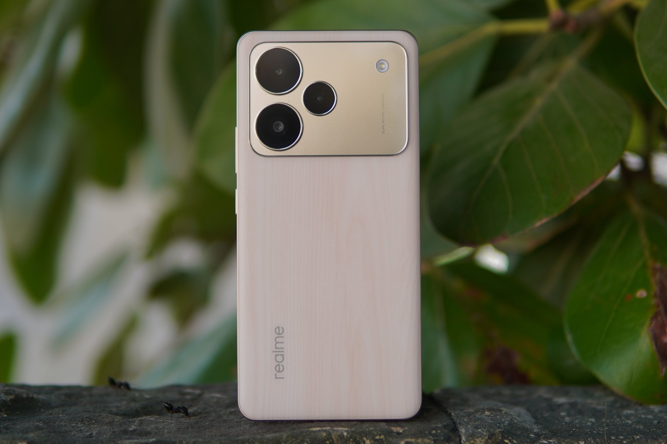 realme P4 Pro 5G smartphone with curved OLED display and premium wood-texture back panel