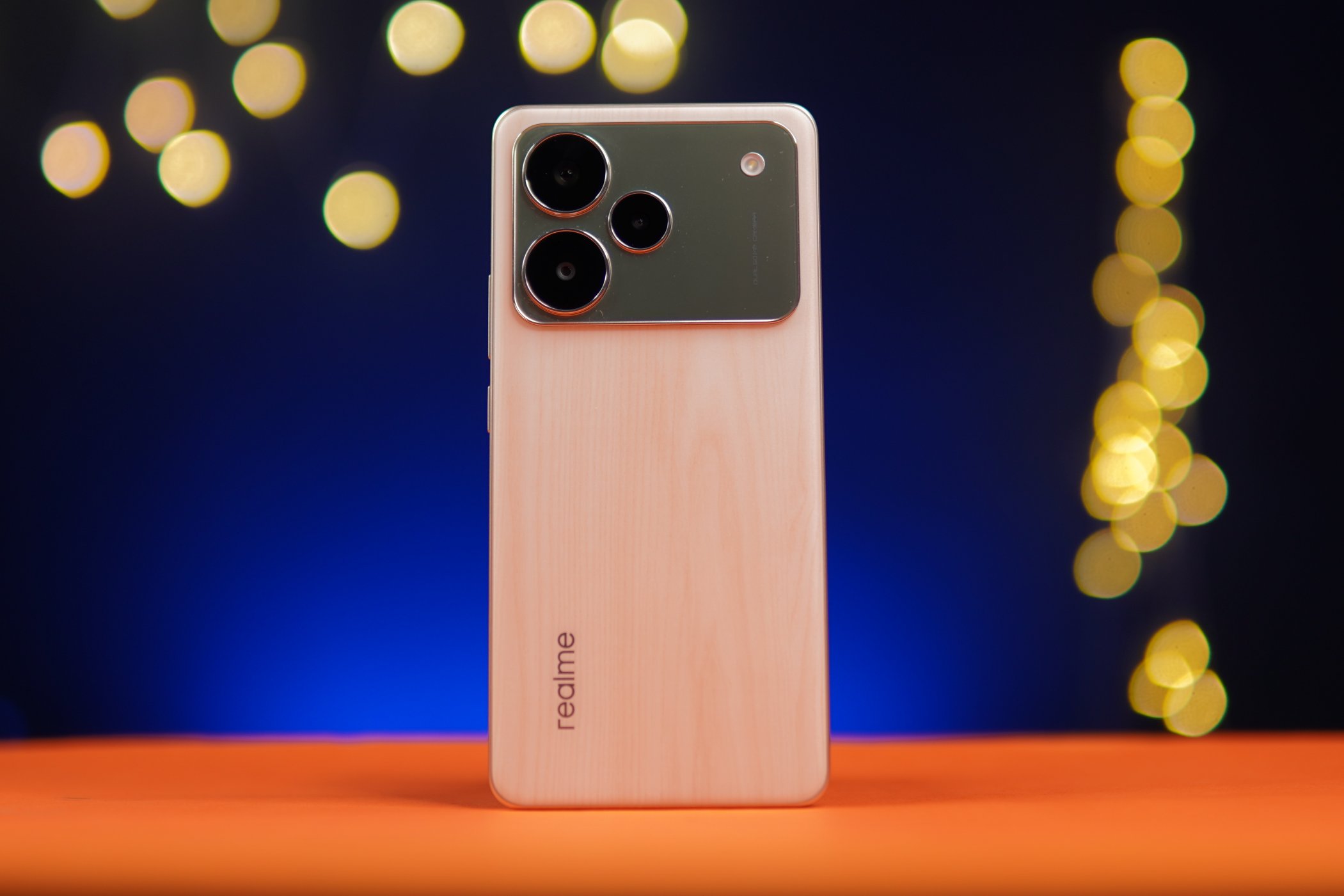 realme P4 Pro 5G smartphone with curved OLED display and premium wood-texture back panel